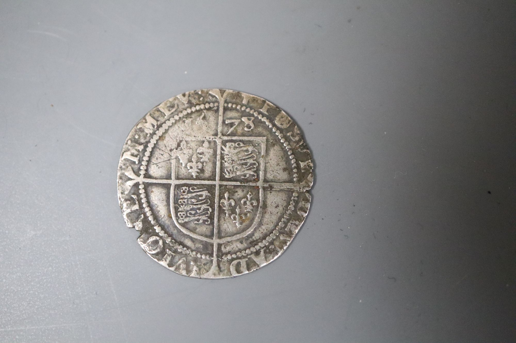 An Elizabeth I 1578 silver sixpence, 4th issue, splits and off centre otherwise F